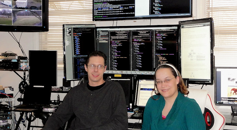 Katie and Brandon in office. Hash Tag The A Team Web site Design DevOps Javacript Stack Development FullStack